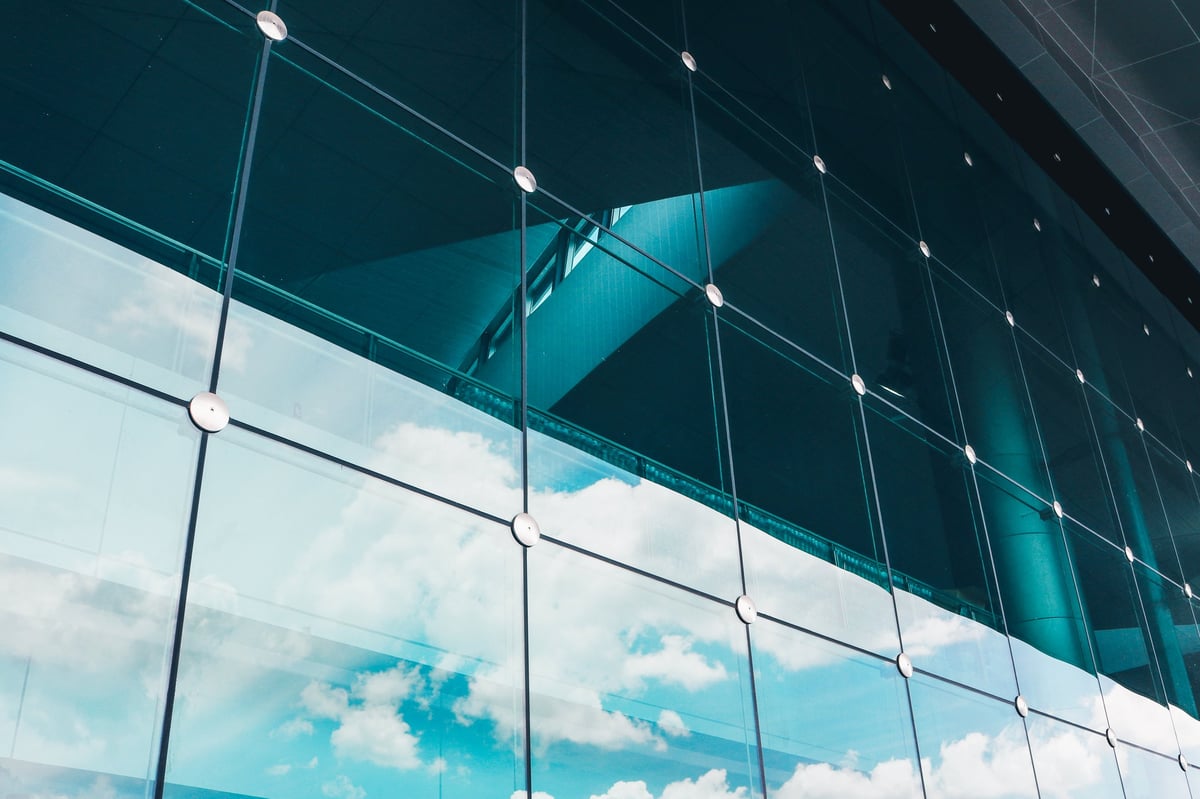 Laminated glass curtain wall facade and cable net structure of a modern building